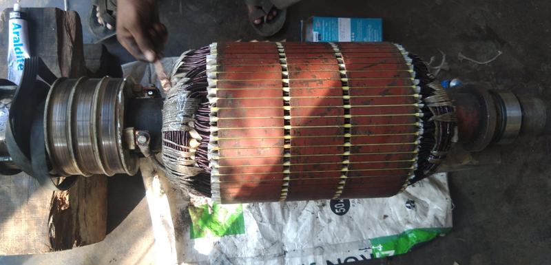 A wound slip-ring motor rotor laid out on the workshop floor